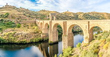 Panoramic View At The Ancient Roman Bridge Over Tajo River In Alcantara, Spain