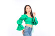 © Png - Video - Photo - Attractive beautiful positive happy smile asian woman hands point up and pose with empty space wearing green shirt and jeans.