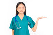 © Png - Video - Photo - Portrait of professional confident young asian female smiling doctor in green scrubs showing presenting finger to empty space, doctor healthcare and doctors concept.