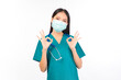 © Png - Video - Photo - Portrait of professional confident young asian female smiling doctor in green scrubs showing OK sign gesture , doctor healthcare and doctors concept.