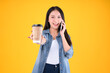 © Png - Video - Photo - attractive pretty asian female smile holding coffee paper cup drink beverage talking on the smartphone Technology communication lifestyles concept.