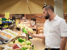 Man Buy Fruits And Vegetables At Supermarket