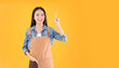 © Png - Video - Photo - pretty asian female smile coffee freelancer own shop ands point up and pose to copy space yellow background.