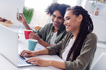 Sticker - Photo of good mood siblings brother and sister have morning coffee surfing in social media laptop do online shopping