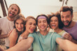 © deagreez - Photo of young cheerful friends happy positive smile have fun make selfie fooling grimace trip outdoors