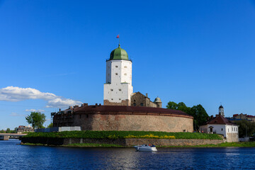 Castle on the water against the blue sky