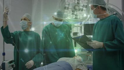 Wall Mural - Animation of network of connections over two caucasian surgeons in operating theater