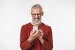 © InsideCreativeHouse - Happy mature middle-aged man freelancer using smart phone cellphone for online texting, social media, e-banking, remote work isolated in white background