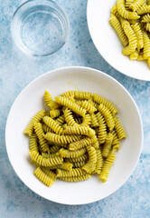 Wall Mural - Plate of pasta with pesto Genovese, with fresh basil, olive oil, garlic and pine nuts