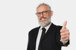 © InsideCreativeHouse - Rich successful caucasian mature middle-aged businessman ceo boss lawyer teacher wearing glasses and formal suit looking at camera showing thumb up isolated in white background