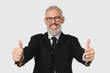 © InsideCreativeHouse - Smiling caucasian mature middle-aged businessman ceo boss lawyer teacher showing thumbs up in formal suit isolated in white background