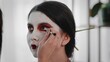 © stanis88 - Close-up A young woman creates the image of a geisha for a girl. Makeup. Creating an image for an event