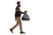 © Ljupco Smokovski - Full length profile shot of a bearded man walking and carrying a plastic waste bag