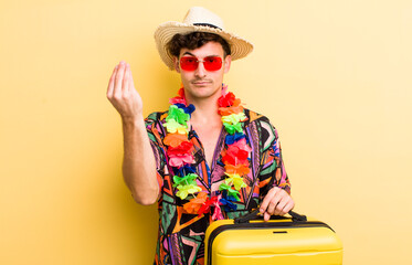 young handsome guy making capice or money gesture, telling you to pay. summer holidays concept