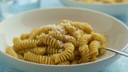 Wall Mural - Plate of pasta with pesto Genovese, with fresh basil, olive oil, garlic and pine nuts