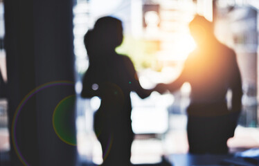 Aufkleber - Partnerships are the backbone to strengthening business. Defocused shot of two businesspeople shaking hands in an office.