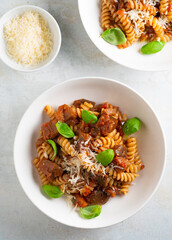 Wall Mural - Pasta alla Norma - traditional Italian food with eggplant, tomato, cheese and basil