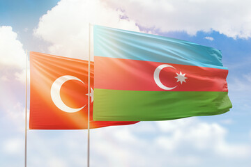 Wall Mural - Sunny blue sky and flags of azerbaijan and turkey