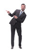 © ASDF - smiling handsome businessman pointing to copy space. isolated on white