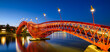 A bridge in the city at night. The bridge against the sky during the blue hour. The Python Bridge, Amsterdam, the Netherlands. Panoramic photography for design and background..