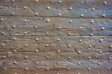 A Closeup Of A Steel Studded Wooden Door