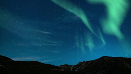 Wall Mural - Aurora Borealis Green Loop Winter Mountain Ridges Northern Lights