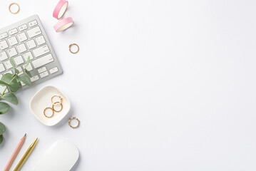 Business concept. Top view photo of workstation keyboard computer mouse eucalyptus stationery pink adhesive tape pen pencil and gold rings on isolated white background with copyspace