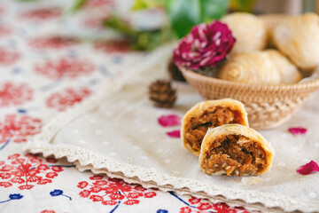 Chinese flaky pastry or mooncake or pie filled shred pork or pork floss decorated gold leaf look so luxury in close up view macro concept to present delicious filling detail. Homemade bakery concept.