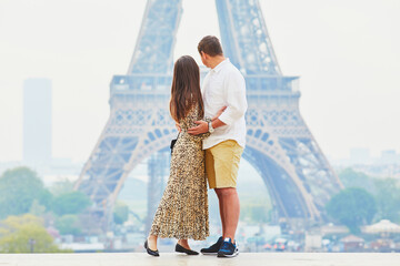 Wall Mural - Happy romantic couple enjoying their trip to Paris, France