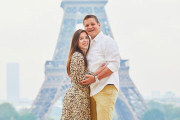 Wall Mural - Happy romantic couple enjoying their trip to Paris, France