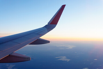 Wall Mural - wing of an airplane. travel tourism air transportation concept. selective focus