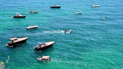 Wall Mural - View of the Tyrrhenian sea coast in Positano, Italy. Multiple boats in the water