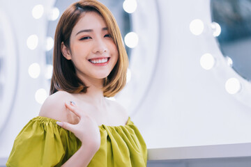 Wall Mural - Image of young Asian girl in the front of mirror