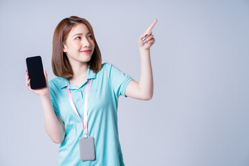 Wall Mural - Portrait of young Asian businesswoman on white background