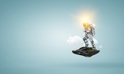 Wall Mural - spaceman on a light bulb