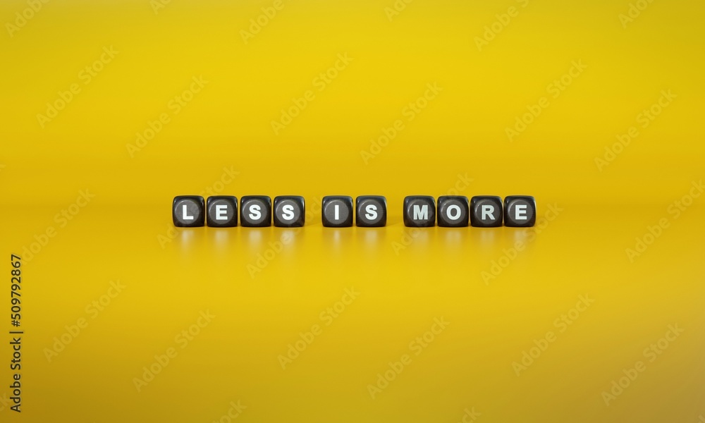 Less Is More Writing Visual Words ‘Less is more’ spelled out in white text on dark wooden blocks ...