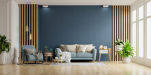 Interior Of Light Room With Sofa And Armchair On Empty Dark Blue Wall Background.