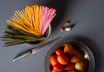 Colorful noodles on a white plate