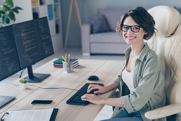 Photo of pretty smiling student girl practicing developing website young system administrator working in office