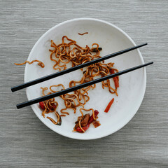 Canvas Print - plate with remains of chicken yakisoba noodles