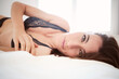 © ADDICTIVE STOCK - Woman in lingerie lying on bed