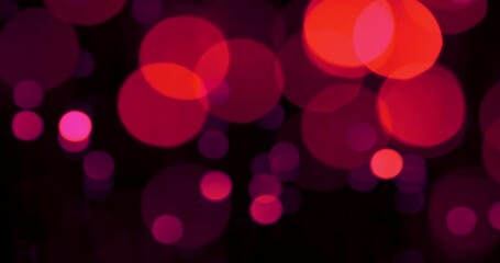 Visual effect - Red bokeh on a black background.