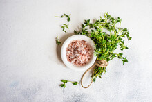 Overhead View Of A Bunch Of Fresh Thyme Next To A Pot Of Pink Himalayan Salt