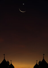 Wall Mural - mosques dome on dusk sky vertical in the evening twilight and crescent moon, religion symbol of isla