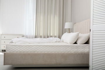 Poster - Comfortable bed with soft white mattress, blanket and pillows indoors