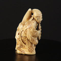 Netsuke figurines on a black background from his own collection
