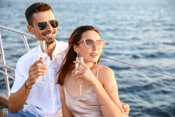 Poster - Happy young couple resting on yacht