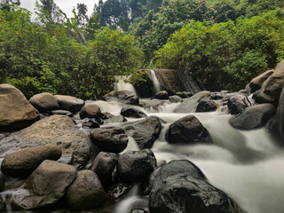 waterfall in the mountains. photo of silky water in the Sumber Podang river, Kediri