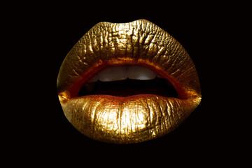 Golden lips with gold lipstick on isolated background. Sensual girl or woman mouth with gold.