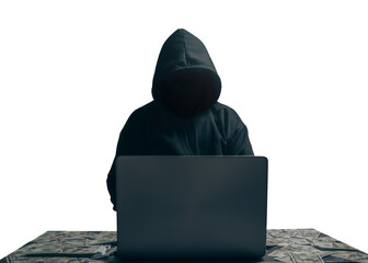 Wall Mural - isolated of Unknown young man hacker sitting playing laptop with lots of money lying around.Concept Massive financial theft